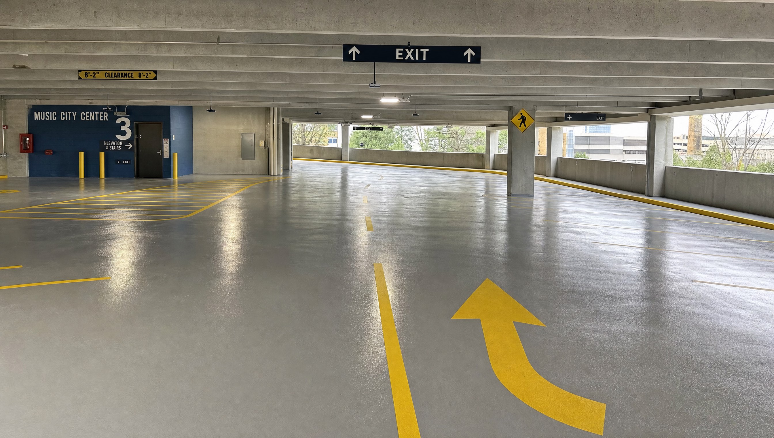 Two car garage with freshly finished glossy gray epoxy floor coating in Nashville
